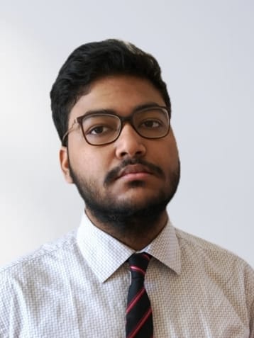 Ruman in shirt and glasses